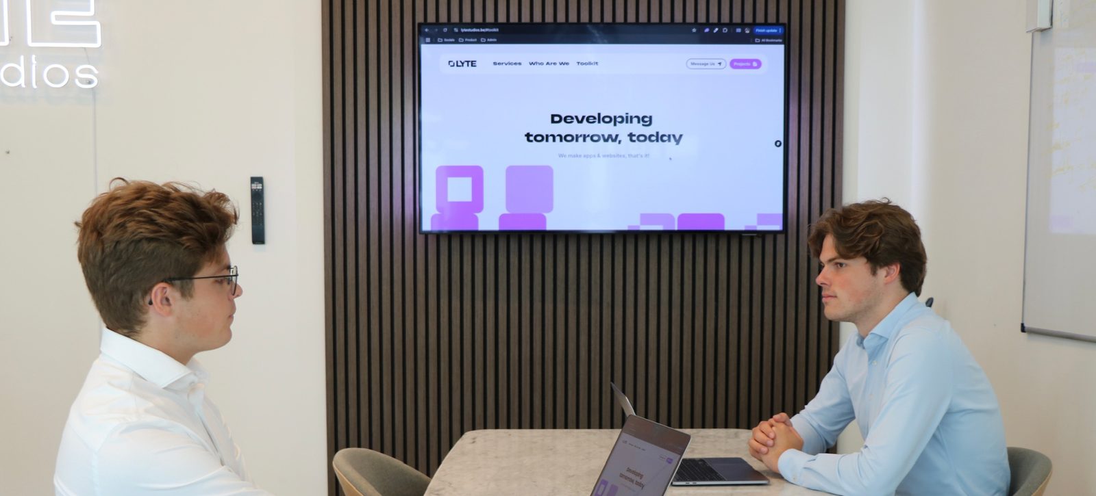 Reviewing a website on the office screen at LYTE Studios